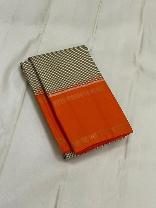 Rust Kattam Korvai – Pure Silk Kanchipuram Saree
Olive–Ivory Micro-Checks Body with Korvai Join
Rust Orange Border
Rust Orange Pallu pillayar Reku
Comes with Matching Rust Orange Blouse Piece with Zari Border silk mark certified - ships in 2 weeks