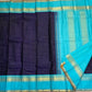 Indigo Teal Kattam – Pure Silk Kanchipuram Saree
Deep Indigo Body with zari Kattam Checks
Teal Contrast Korvai Border with maanga pet and mayil kann border, maanthulir selvedge  , silk mark certified -ships in two weeks