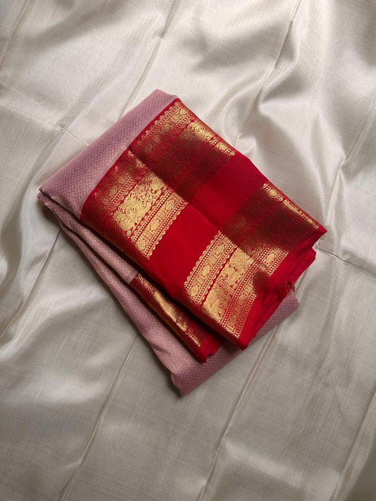 Calm pastel pink meets bold vibrant red , pure silk Kanchipuram rettapettu border annam motif