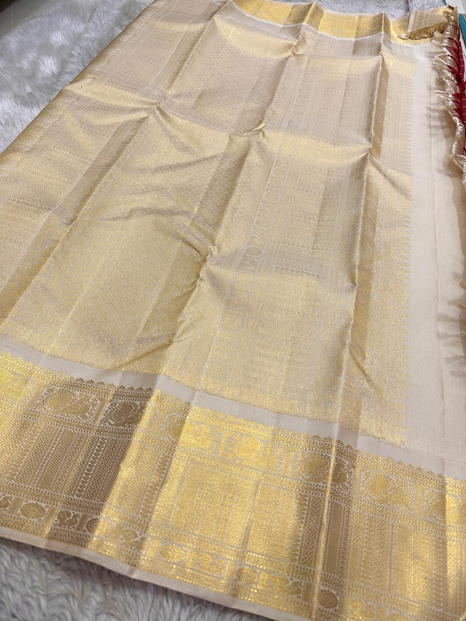 Full pallu image of champagne-gold zari weaving with traditional temple motifs in Kanchipuram silk saree