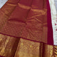 Ivory Mayil – White Mayil Butta Korvai Kanchipuram Silk Saree
Pure handloom silk | Ivory body with gold peacock buttas
Wine-maroon korvai border with peacock & floral zari motifs
Grand gold-zari brocade pallu | ships in two weeks
Silk Mark Certi