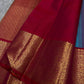 Grand gold zari woven pallu with red contrast edge and ornate detailing
