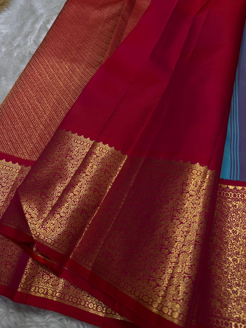 Grand gold zari woven pallu with red contrast edge and ornate detailing
