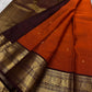 Rust Annam Butta — Kanchipuram Pure Silk

Rust-orange (semman/rust) body with zari chakram buttas

Deep maroon korvai borders with annam (swan) vine motifs

Lavish maroon-gold zari pallu with temple serrations

Silk Mark Certified | Free Shipping