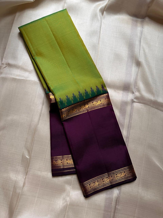 Sivakami ✨
Royal Aubergine & Parrot-Green Korvai Kanchipuram Pure Silk Saree
With Purple Thazampoo Reku Crown & Rettapet Mayil Zari Border
Grand Gold Brocade Pallu with Temple-Inspired Detailing
Silk Mark Certified | Handloom Heirloom Elegance