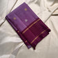 Ilam  Vadamalli Chakram — Kanchipuram Pure Silk

Pastel lilac–mauve body with gold & silver chakram buttas

Deep plum contrast border with twin kaddi zari lines

Plum pallu with elegant vertical zari stripes; lilac tassels

Silk Mark Certified •
