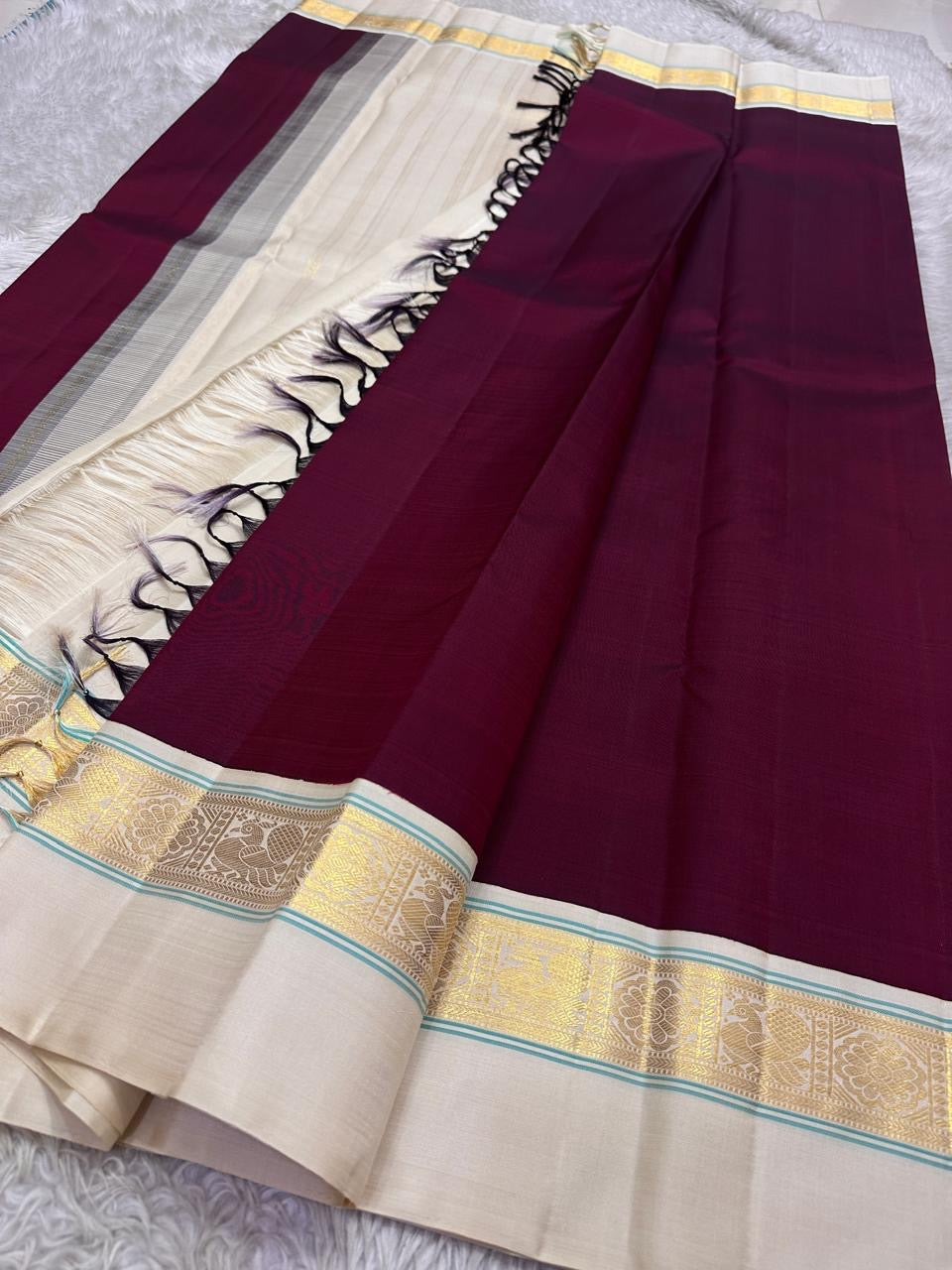 Maroon  Pure Kanchipuram Silk Saree with Kaal Erangina ivory  Zari Border