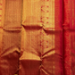 Nakshatra – Radiant Red Vairaoosi Kanchipuram Silk Saree Adorned with Mayil & Chakram Zari Buttas, Featuring an Ornate Kamalam and Floral Vine Zari Border, Flanked by Varisaipet Motifs, and a Pallu Woven with Sacred Thulasi Madams and Regal Kamalams
