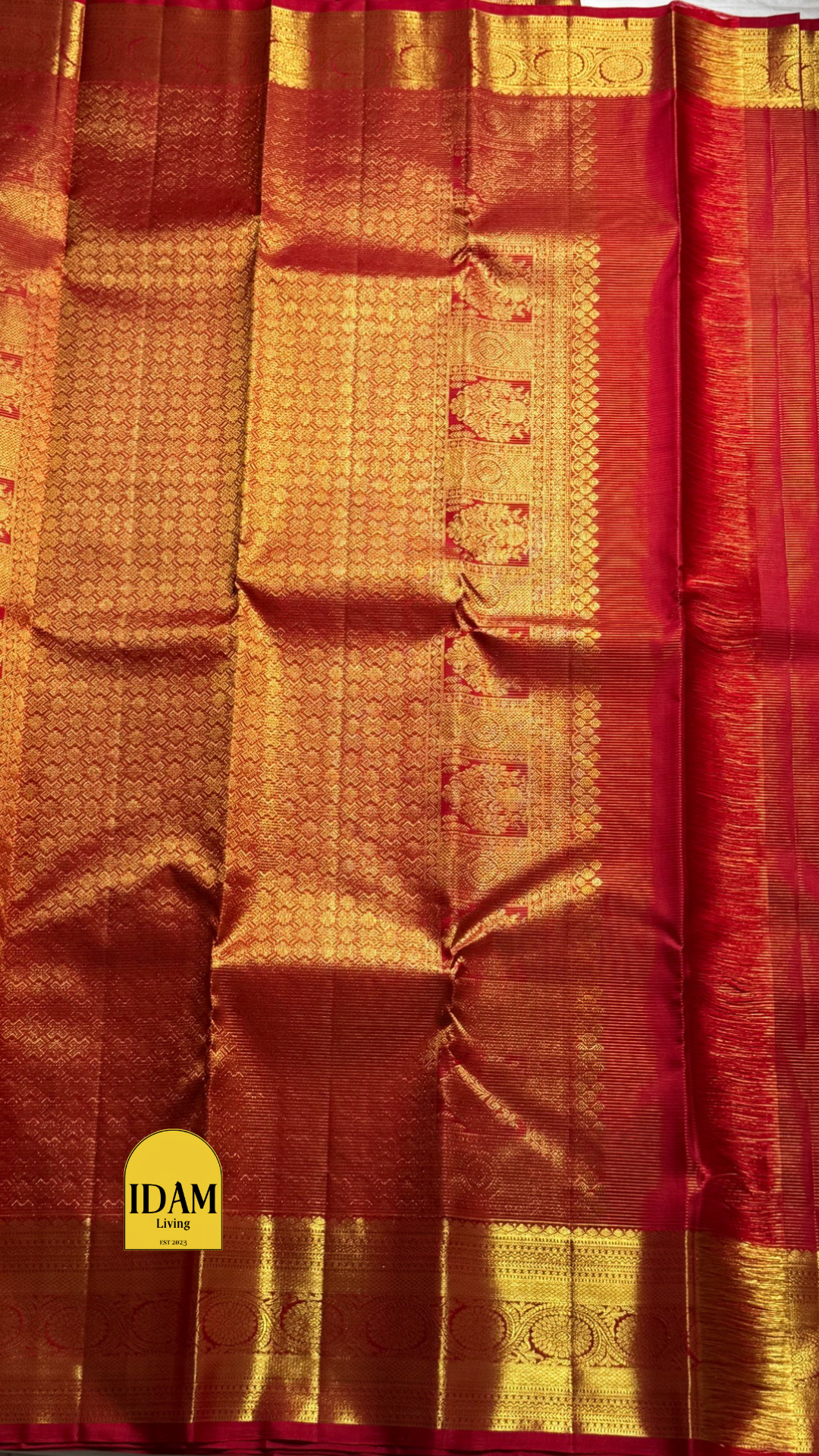 Nakshatra – Radiant Red Vairaoosi Kanchipuram Silk Saree Adorned with Mayil & Chakram Zari Buttas, Featuring an Ornate Kamalam and Floral Vine Zari Border, Flanked by Varisaipet Motifs, and a Pallu Woven with Sacred Thulasi Madams and Regal Kamalams