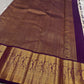 Ivory silk meets tradition in this elegant Kanchipuram saree. With a deep purple border and Mayuri motifs, it’s perfect for moments that call for quiet richness.