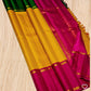 Swarna Kattam Ganga Jamuna — Pure Silk Kanchipuram Saree
Golden mustard kattam checks body • Dual korvai borders in rani pink & emerald green
Rich zari pallu with radiant festive sheen
Contrast emerald blouse with zari selai finish
Silk Mark Certified •