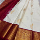Ivory Mayil – White Mayil Butta Korvai Kanchipuram Silk Saree
Pure handloom silk | Ivory body with gold peacock buttas
Wine-maroon korvai border with peacock & floral zari motifs
Grand gold-zari brocade pallu | ships in two weeks
Silk Mark Certi