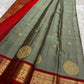 Sorgavaasal Kili , stunning motif in  golden dove grey and red zari kattam zari woven yazhi buttas in pure silk kanchipuram
