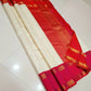 Ivory & Vermilion Rettapet Kattam
Pure Kanchipuram Handloom Silk
Auspicious Red Glow with Gold Zari Grid