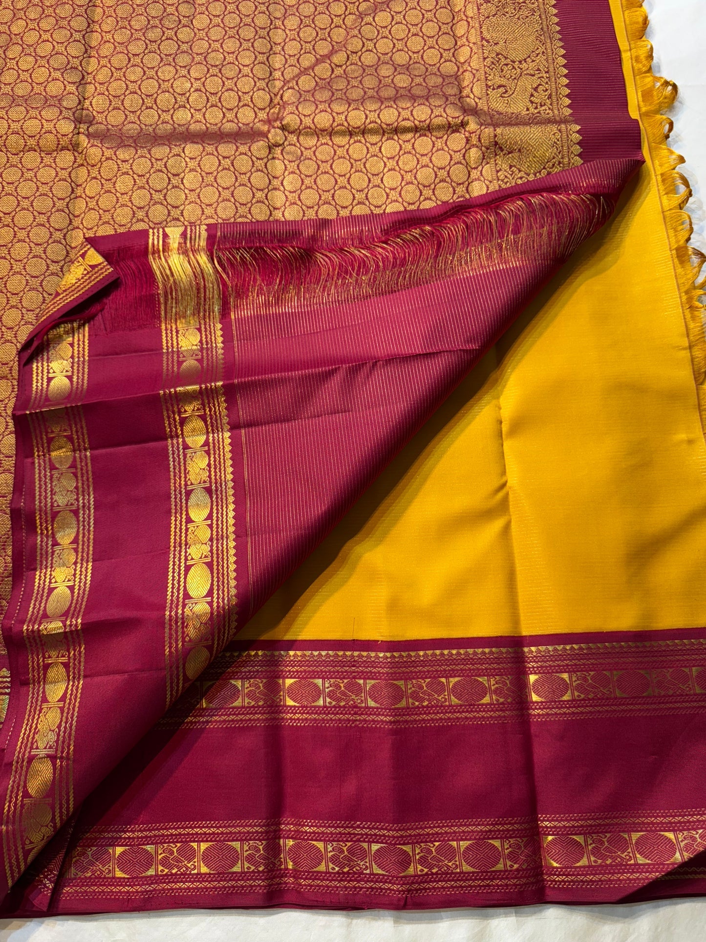 Swarna Manjal vairaoosi 
Pure Silk Kanchipuram Saree – Radiant Mustard Yellow Body with Maroon Border & Grand Brocade Pallu
Silk Mark Certified ✅
Fall & Pico Done ✅ | Blouse Stitching Available ($30) ✅
Free Shipping within the USA ✅ | Ships in Two Weeks ✅