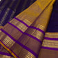 Swarna Laya — Pure Silk Kanchipuram Saree
Deep vaadamalli purple with gold zari buttas, antique-gold border, and rich striped pallu.
Silk Mark Certified • Free USA Shipping • Ships in Two Weeks.