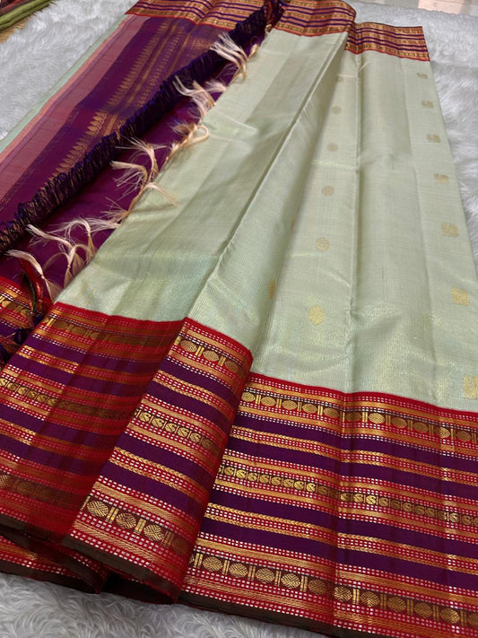 Pure silk kanchipuram grey with sampanga green vairaoosi with detailed ornate varisaipet border thandavalam zari , mayil Butta