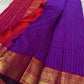 Amethyst Zari Kattam – Pure Kanchipuram Silk Saree
Rich Amethyst Purple Body with Golden Zari Checks
Broad Gold Zari Border with Red Highlights & Temple Motifs
Radiant Ruby Red-Orange Pallu with Lustrous Zari Stripes

Silk Mark Certified, delivery in 2 we
