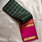 Rani Maragatham Zari Kattam — Pure Silk Kanchipuram (Handloom)
Emerald green body with fine gold kattam checks & zari lines • Vibrant rani-pink border with temple coin motifs
Rich rani-pink pallu with antique-gold zari panels • Silk Mark Certified ✅ Free