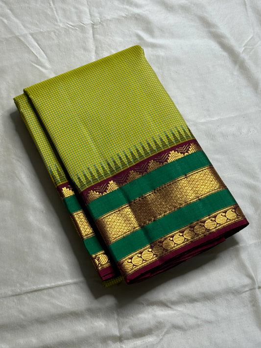 Gita  
Pure Silk Kanchipuram Saree  
Sampanga & Pea Green Podi Kattam  
Arakku Border with Triple Zari Bands