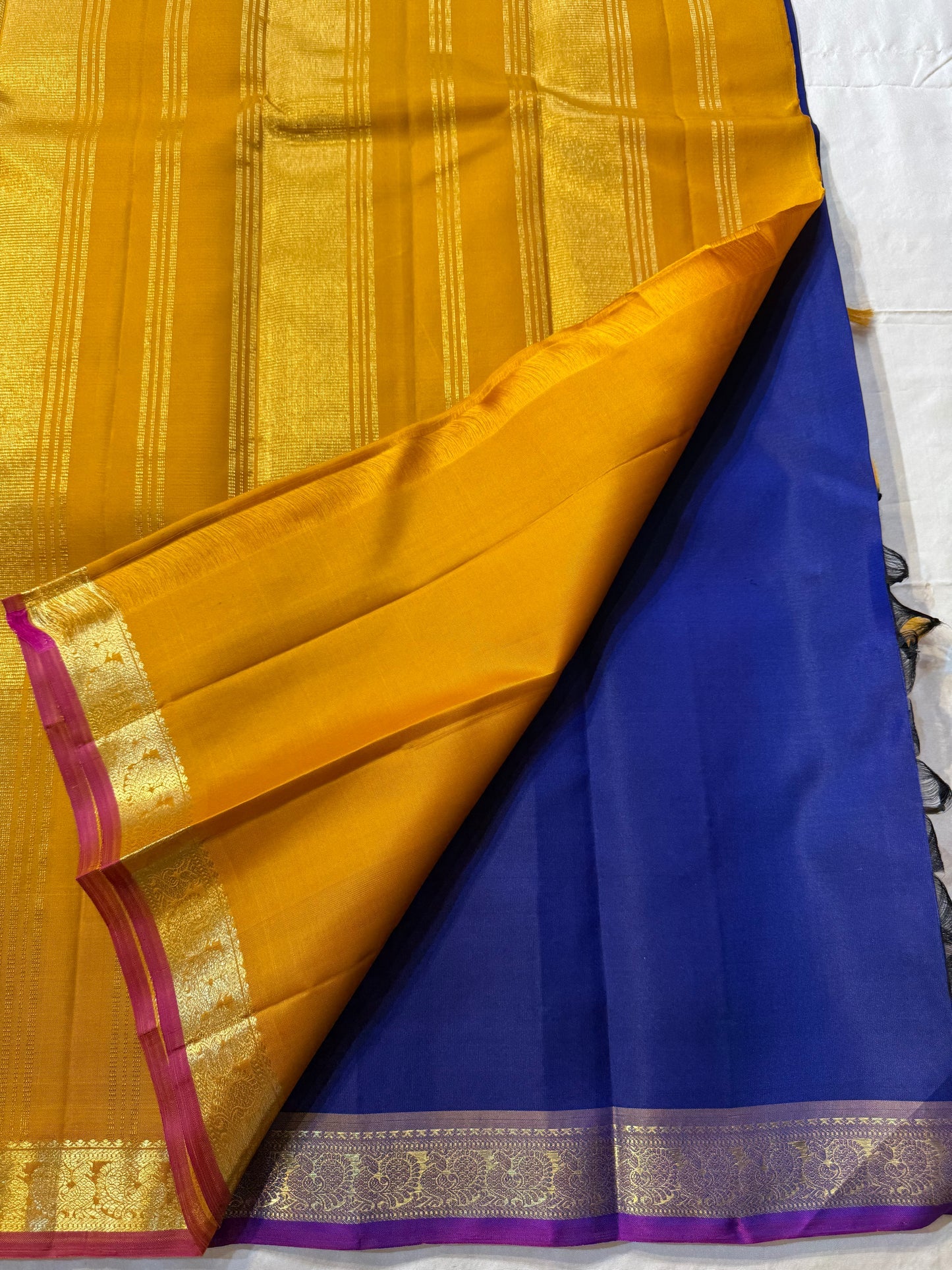 Devasri – Exquisite MS Royal Blue Silk Saree with Alternating Woven Zari Paisley & Floral Buttas, Petite Mauve-Purple Magenta Arai Maadam Border, and Breathtaking Golden Mustard Seer Pallu with Peacock Motifs