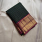 Pachai Zari Kattam – Pure Kanchipuram Silk Saree
Deep Emerald Green Body with Gold Zari Checks
Broad Golden Border with Magenta Highlights & Temple Motifs
Royal Magenta Pallu with Lustrous Zari Stripes

Silk Mark Certified, delivery in 2 weeks