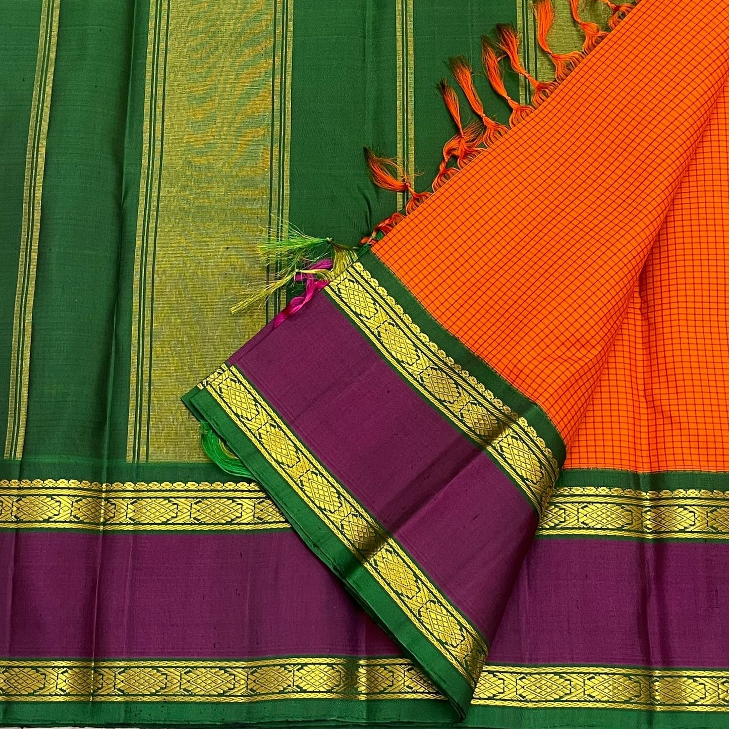 Sunset Kattam — Pure Kanchipuram Silk Saree
Sunset-orange kattam body with royal purple borders and emerald green pallu in fine zari.
Silk Mark Certified • Free Shipping within USA • Ships in Two Weeks