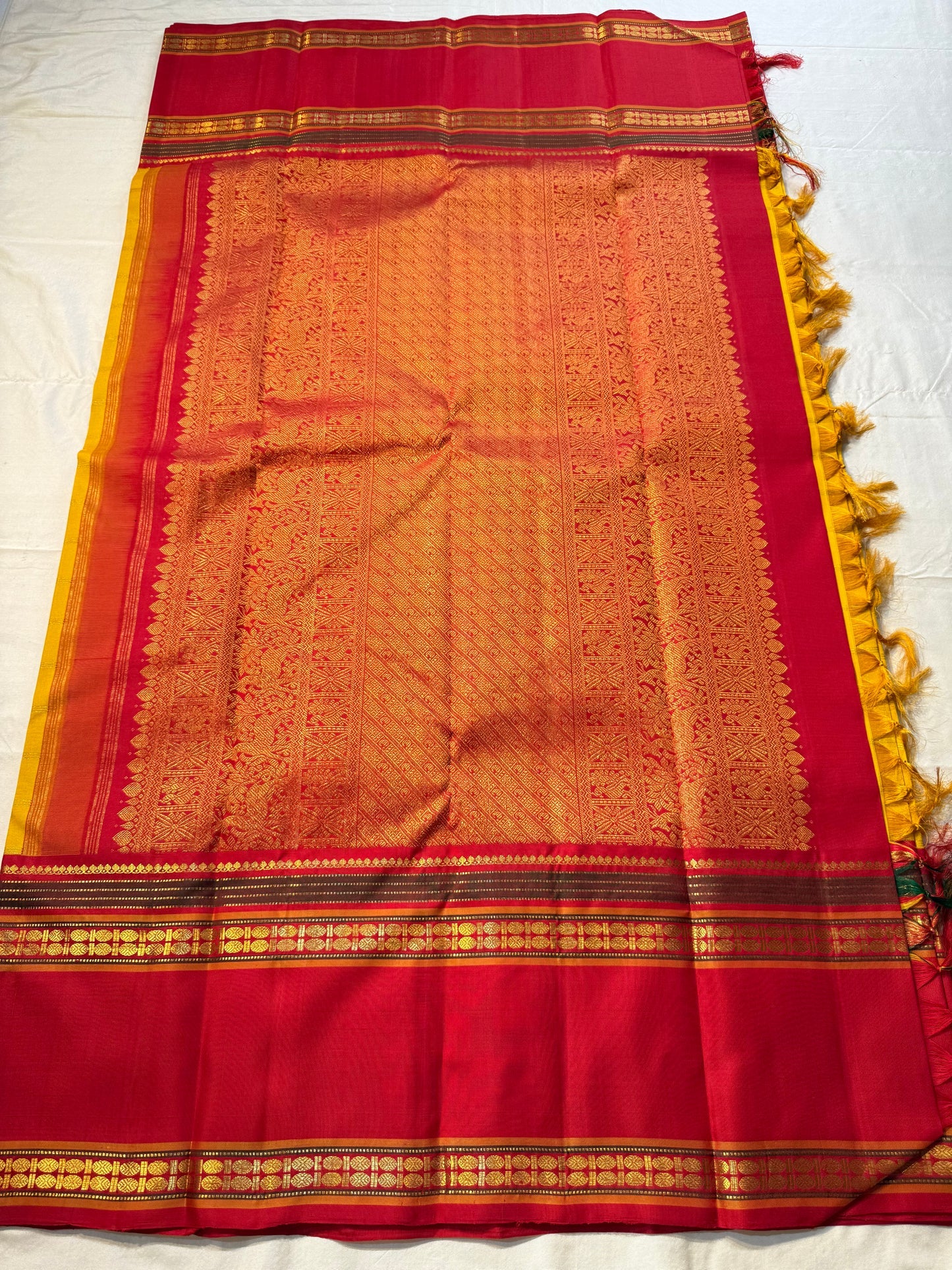 Vasantha Malli ✨
Pure Kanchipuram Silk Saree in Marigold & Kumkum Red
Marigold body with delicate woven checks
Kumkum-red border highlighted with Manthulir Green

Silk Mark Certified, delivery in 2 weeks