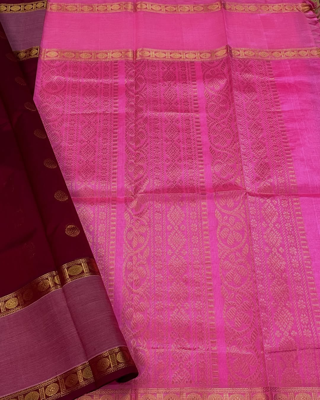 Cherry Red Silk Cotton Saree  
Raspberry Pink Rettapet Border  
Pavun Coin Butta All Over  
Grand Floral & Rudraksham Pallu