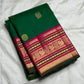 Deep emerald green Kanchipuram saree body with scattered Kamalam and Kili butta in gold zari — close-up