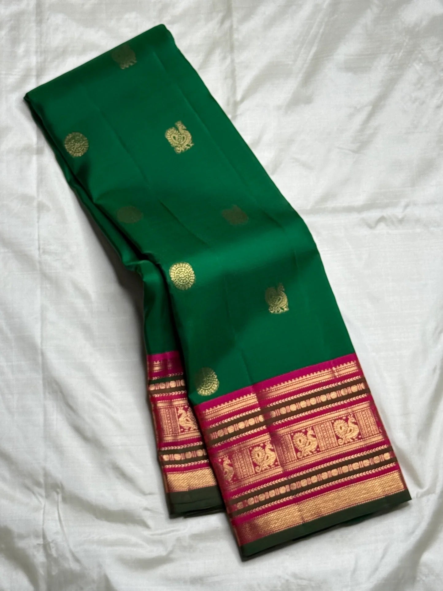 Emerald green and magenta handwoven pure silk Kanchipuram saree with Varisaipet border — full overview