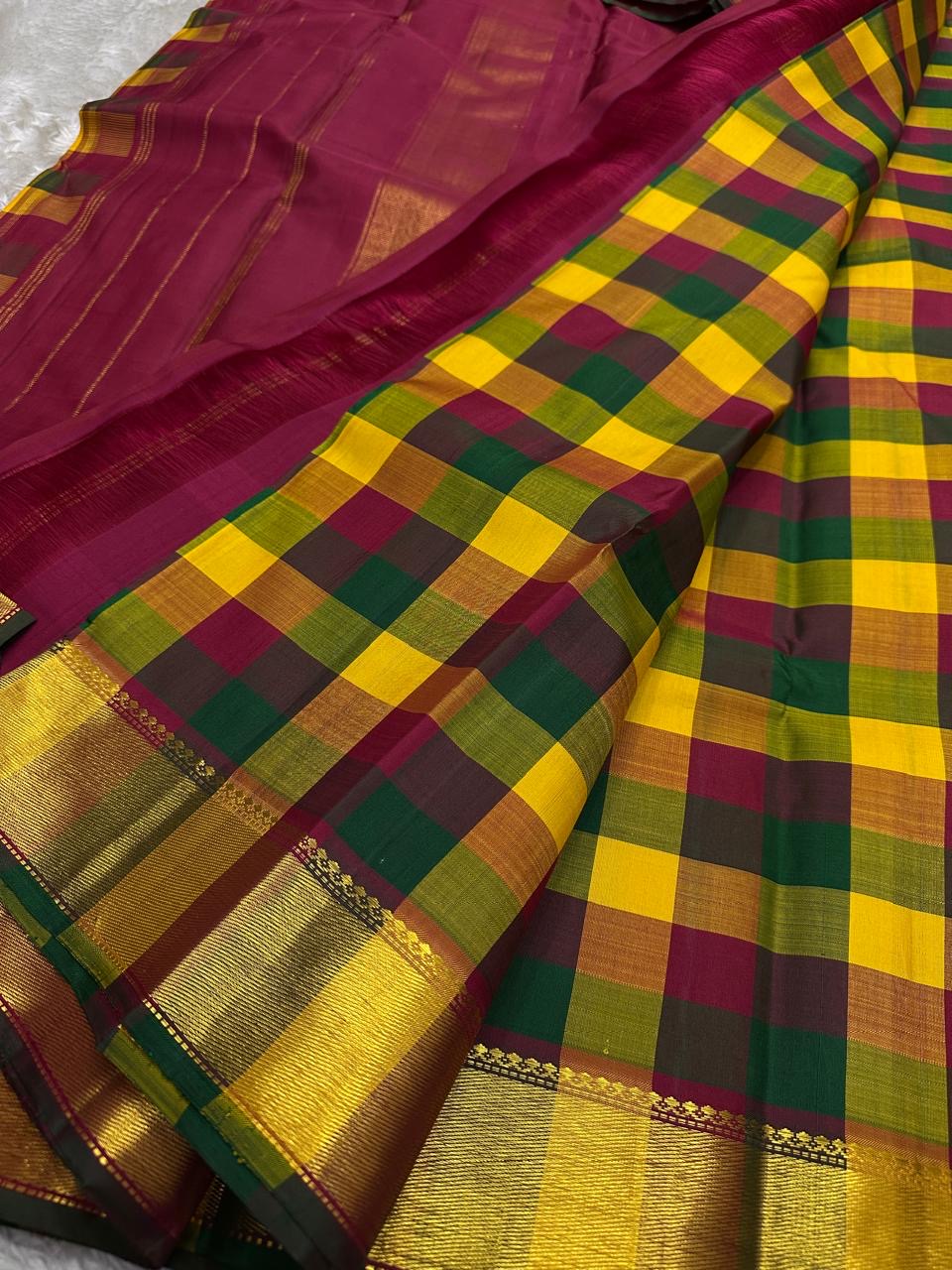 Paalum Pazhamum kattam checks close-up with wine pallu and broad gold zari border