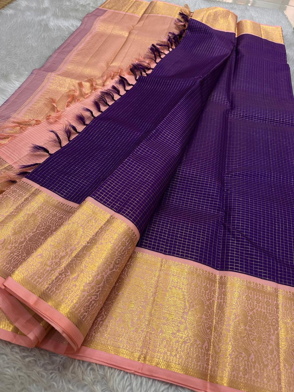 Purple  Zari kattam with pastel pink peach border peacock motif and Pallu