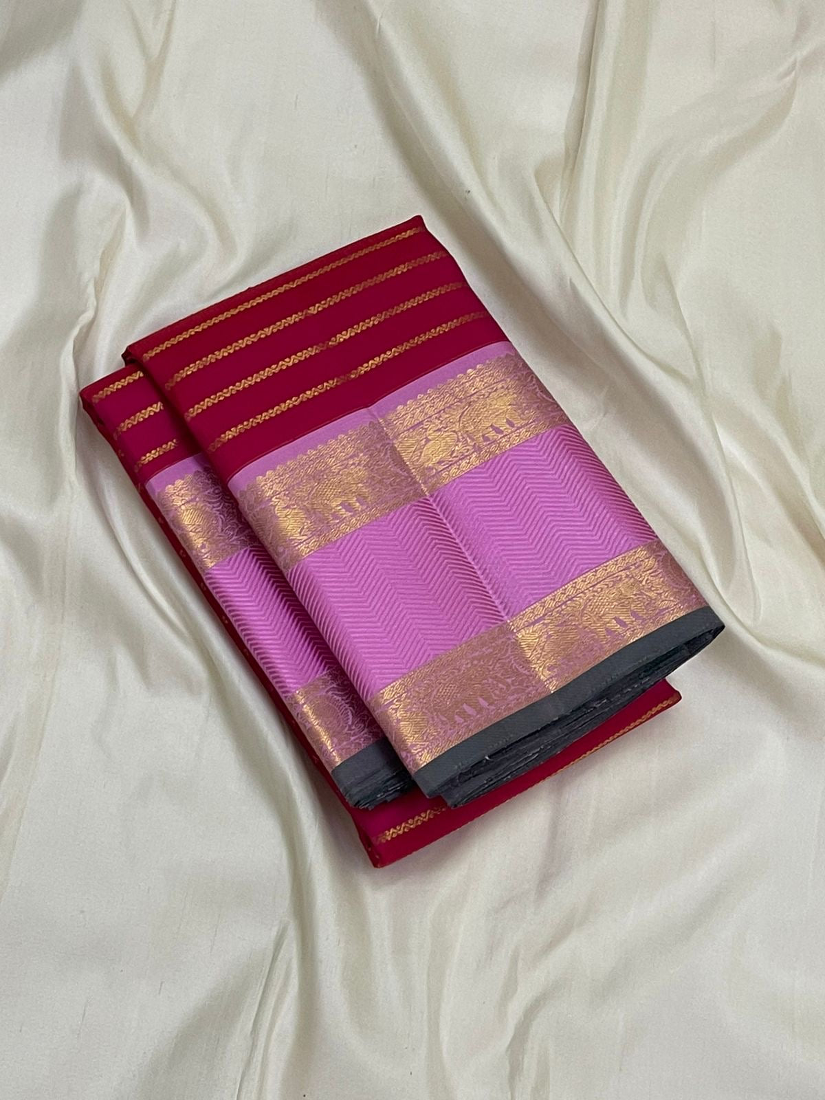 Peony Sringara Velthari — Pure Kanchipuram Silk Saree
Rani magenta body with gold velthari stripes and peony-pink chevron zari border
Silk Mark Certified • Free Shipping within USA • Ships in Two Weeks ✅