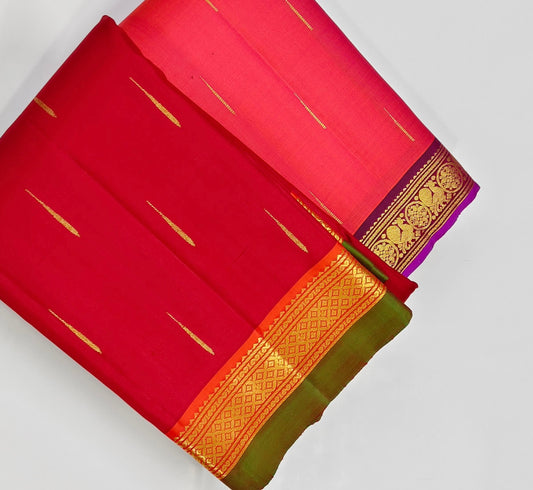 Mullai Moggu Red — Pure Kanchipuram Silk Saree
Deep kumkum-red body with mullai bud zari buttas & antique-gold border with green selvedge
Radiant orange-gold zari pallu • Silk Mark Certified • Free Shipping within USA • Ships in Two Weeks