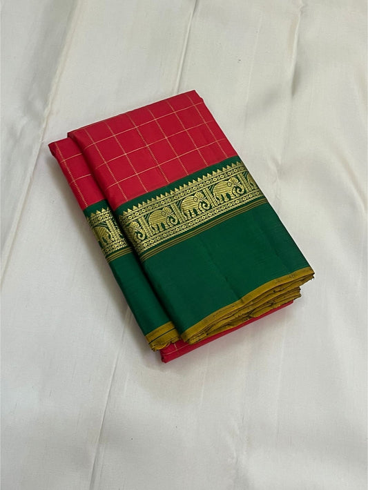 Emerald Ruby Korvai
Pure Kanchipuram Silk Saree – Ruby Red Body with muthu kattam  Grid Checks
Emerald Green Korvai Borders Adorned with Zari Elephant Motifs
Grand Green Zari seer Pallu with Traditional motifs 
Silk mark certified, ships in 2 weeks