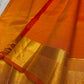 Agnika – orange Kanchipuram Silk Saree with Mayil Chakram Butta & Orange Border Fiery and regal, Agnika is a pure Kanchipuram silk saree featuring a rich red body adorned with intricate Mayil Chakram buttas.