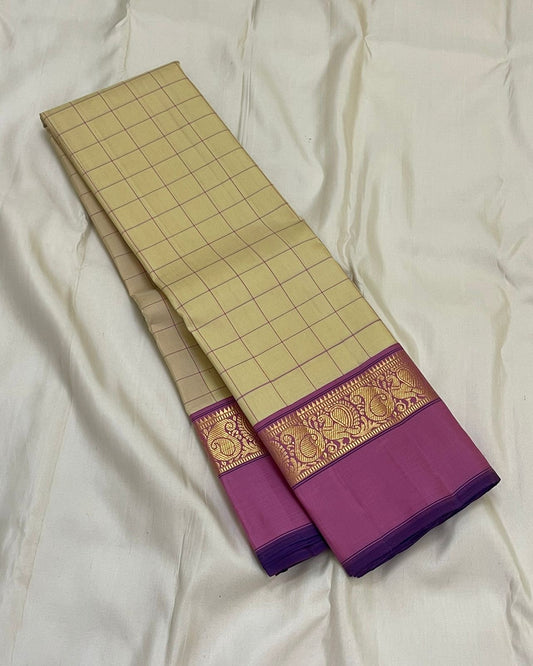 Lotus Kattam — Pure Kanchipuram Silk Saree
Butter-cream body with fine rose-pink kattam checks ✨
Rani-magenta zari border with lotus vines & paisley motifs 💖
Silk Mark Certified ✅ Free USA Shipping ✅ Ships in Two Weeks ✅