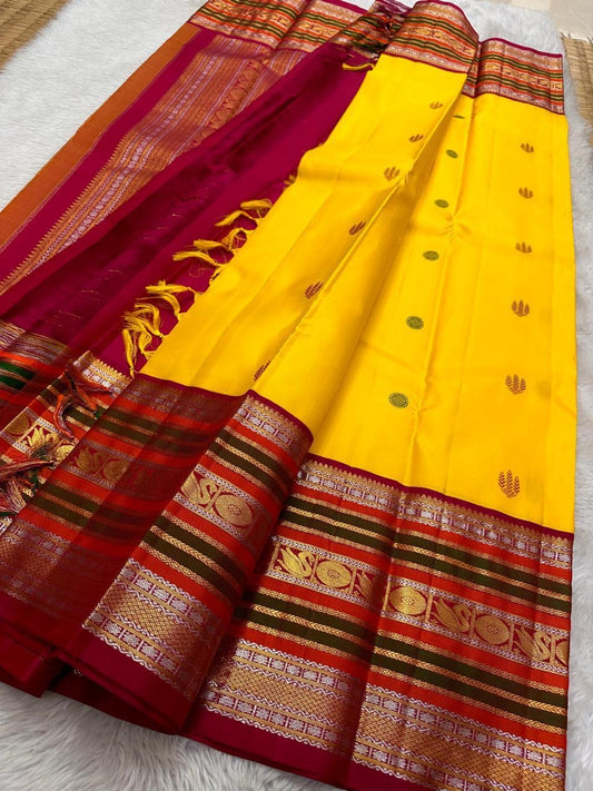 Bhavya – Mustard & Maroon Kanchipuram Pure Silk Saree
Featuring Lotus & hamsa  Motifs in Luxurious Sonaroopa Zari
A Timeless Elegance Woven for Celebrations and Special Moments