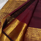 A majestic maroon Kanchipuram silk saree, adorned with intricate golden zari featuring the mythicalYazhi (Yali ) motifs—a symbol of divine strength and protection in Hindu mythology. The grand temple-style gold border adds depth and regality, making this