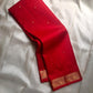 Mahima –red
A luminous red pure silk Kanchipuram drape adorned with delicate baby  kamalam buttas. The petite border features muthu seer and zari-woven elephants with floral vines. Its grand pallu showcases annams, golden grids, and Rudhraksham seer.