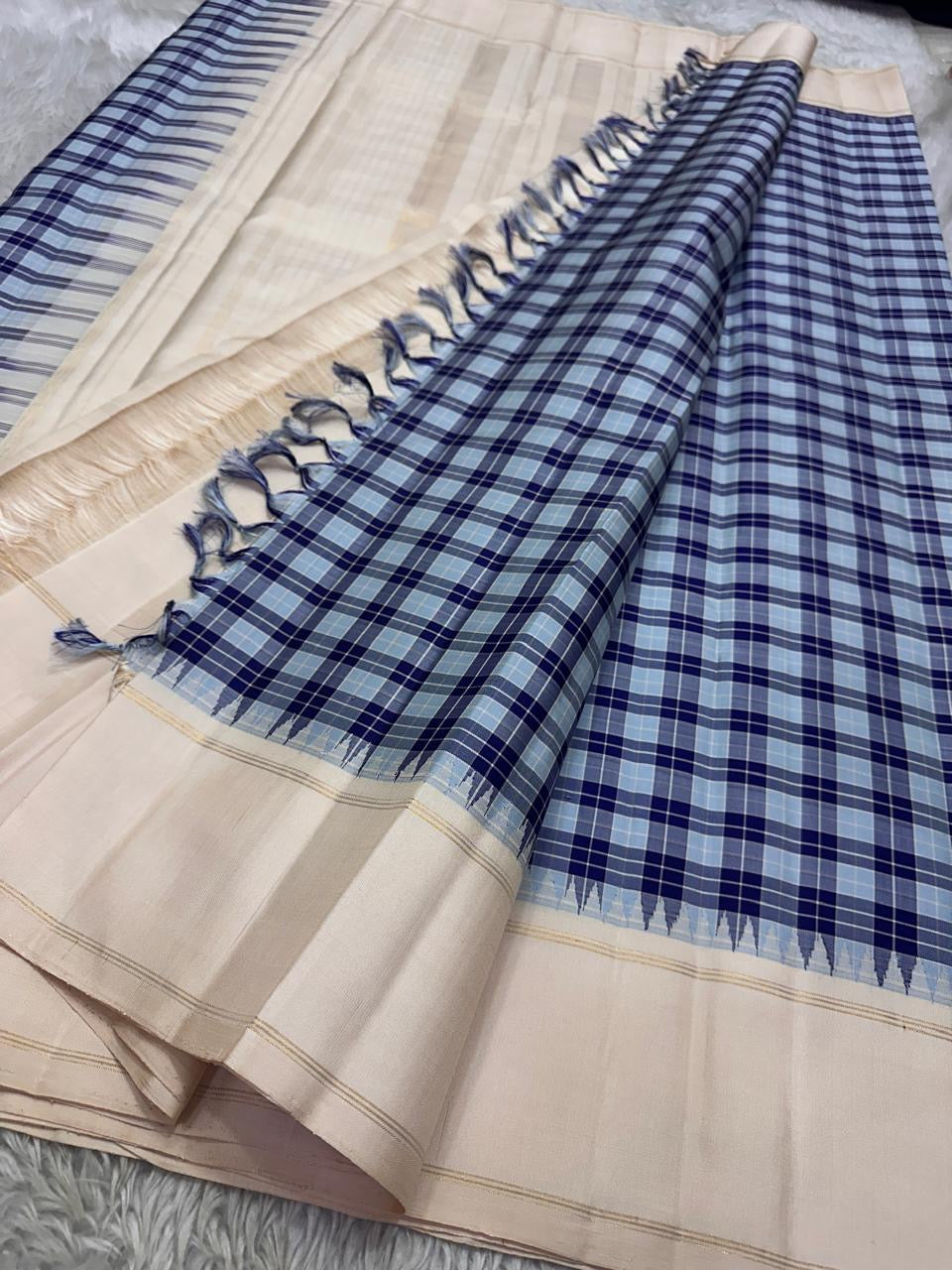 Nirai – Pastel Blue Kanchipuram Pure Silk Saree
Madras-Inspired Podi Kattam Checks in Navy, Cream & Silver
Cream Border with Subtle Zari Stripes
Seer Zari Pallu on a Canvas of Soft Cream Silk 🌿