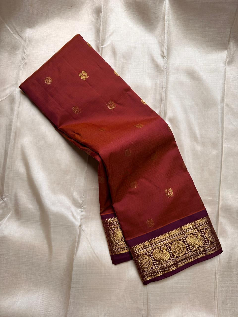 Swaram Lightweight Maroon
Feather-Light Maroon Kanchipuram Silk Saree
Zari-Woven Peacock Medallion Border