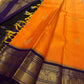 Pure Kanchipuram Silk Saree – Saffron-Orange Body with Gold Zari Paisley Buttas
Contrast Deep Purple Korvai Borders with Intricate Temple & Floral Motifs
Grand Purple Zari Pallu with Diagonal zariWeave . Silk mark , ships in 2 weeks