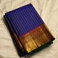 Neela Ratnam — Pure Silk Kanchipuram

• Cobalt-blue kattam checks with antique-gold zari

• Ruby-maroon contrast pallu with grand zari work

• Floral vine borders with bottle-green selvedge

• Silk Mark Certified • Ships in Two Weeks • Free Shipping withi