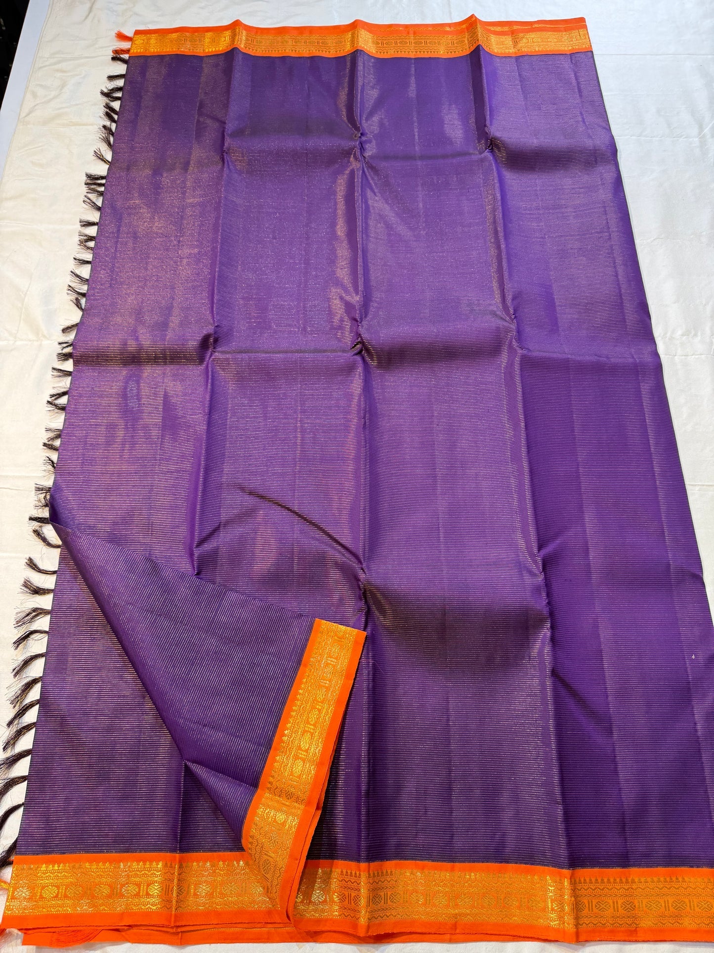 Amara Vairaoosi – Kanchipuram Pure Silk Saree ✨
Purple Vairaoosi Body with Fine zari Pinstripes
Striking Orange Korvai Zari Border
Molten Orange Grand Zari Pallu

Silk Mark Certified, delivery in 2 weeks