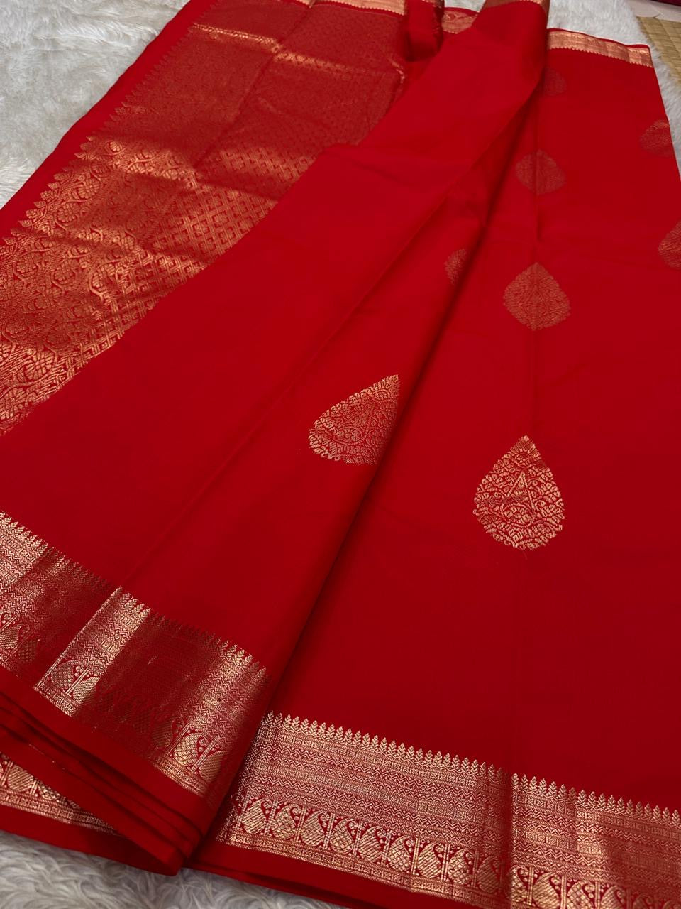 Thamarai Red — Pure Kanchipuram Silk Saree
Temple Red with Gold Zari Leaf Buttas & Diamond Jaal Pallu
Silk Mark Certified • Free Shipping within USA • Ships in Two Weeks