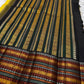 Marigold Mani Kattam – Pure Kanchipuram Silk Saree
Vibrant marigold yellow body with classic kattam checks
black borders with elephant & floral zari motifs
Rich black pallu adorned with green & zari stripes . Silk Mark Certified, delivery in 2 weeks