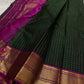 Pachai Zari Kattam – Pure Kanchipuram Silk Saree
Deep Emerald Green Body with Gold Zari Checks
Broad Golden Border with Magenta Highlights & Temple Motifs
Royal Magenta Pallu with Lustrous Zari Stripes

Silk Mark Certified, delivery in 2 weeks