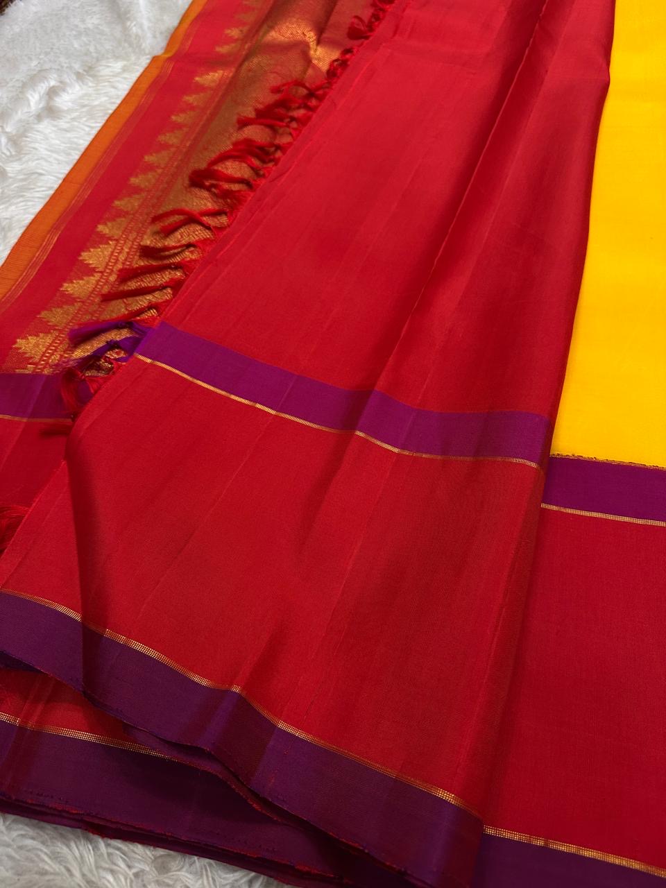 Full view of silk saree with rich zari pallu, vermilion body and magenta border